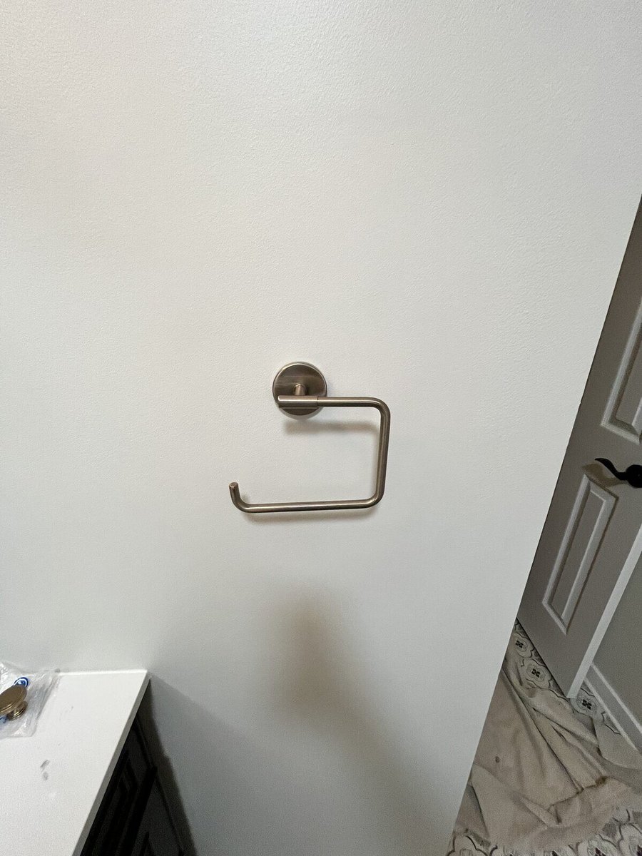 Bathroom remodel detail showing a sleek gold towel holder, completed by Clear Contractors in Northwest Indiana