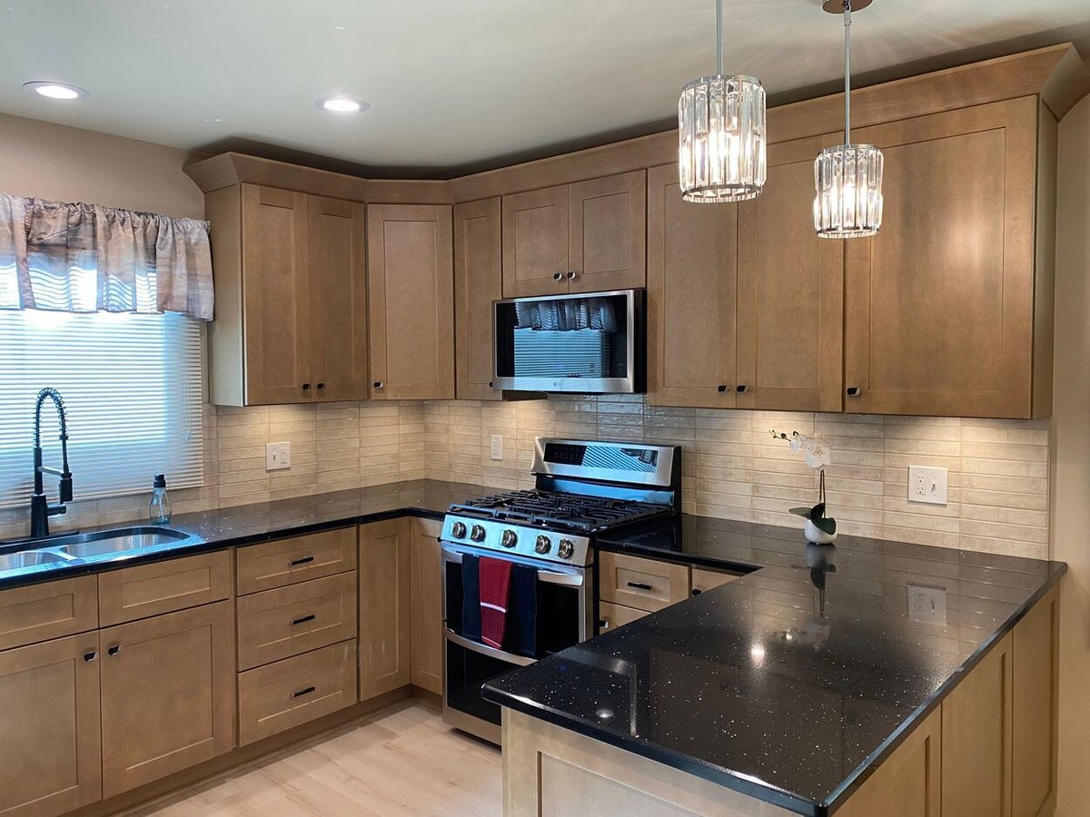 itchen featuring built-in microwave and new lighting fixtures from a kitchen remodel in Lynwood by Clear Contractors